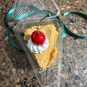 Decorative Cheesecake Slice with Cherry Topper